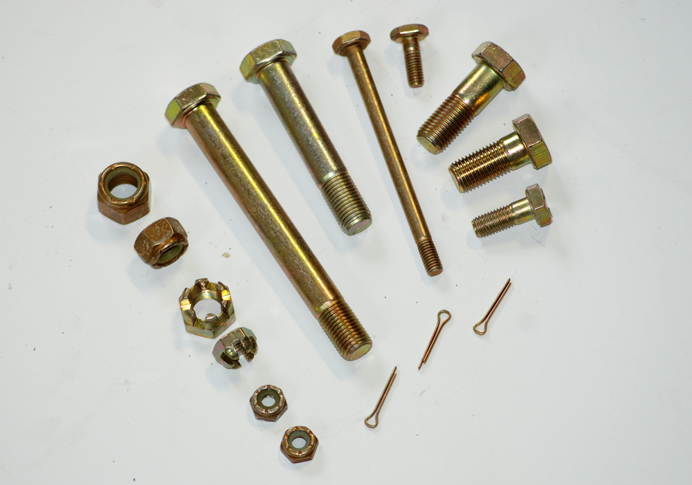 a collection of engine fasteners on a table