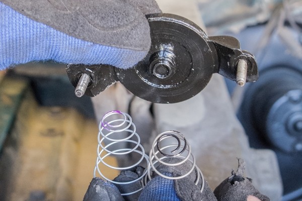 disassembling a mechanical secondary for a carburetor