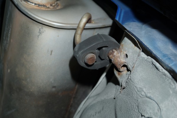 factory exhaust hanger installed on a subaru wrx