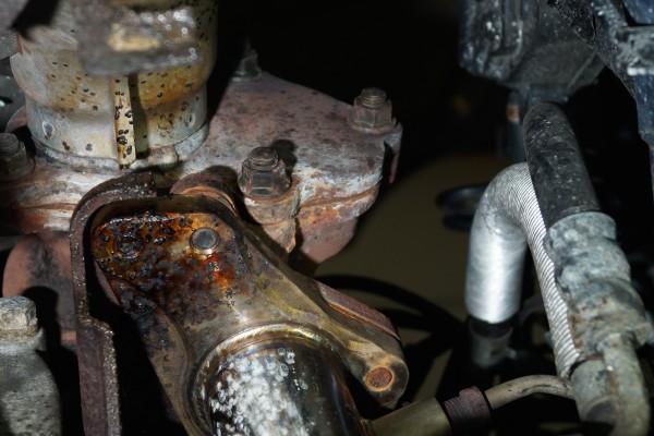 view of stock subaru wrx exhaust bracket