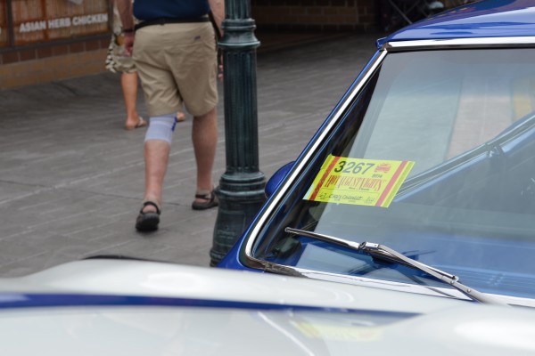 hot august nights sticker on windshield of a classic car