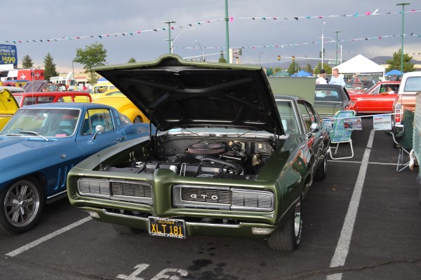 second gen green pontiac gto coupe with hideaway headlights