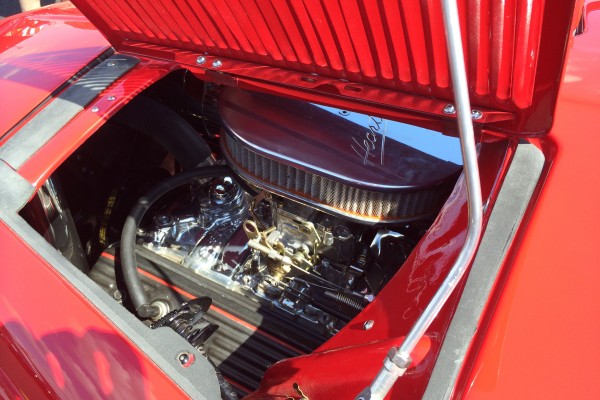 v8 engine under the cowl of a vintage hot rod