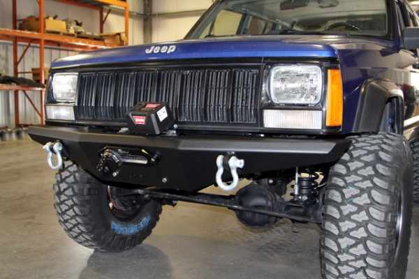 Front of a jeep cherokee XJ with off-road bumper and winch installed