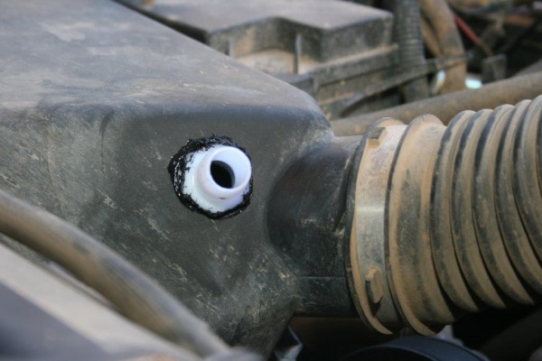 pipe fitting installed in an engine airbox
