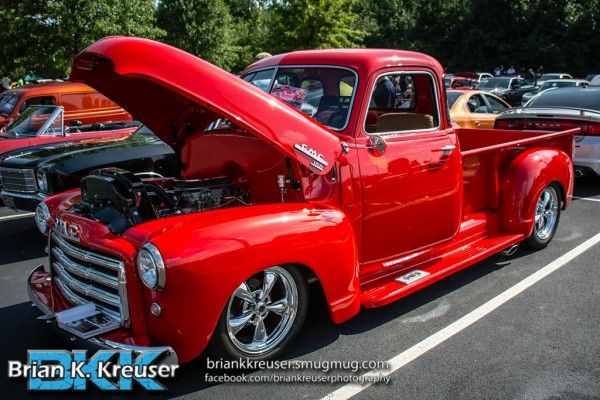 vintage gmc 100 pickup truck at a car show