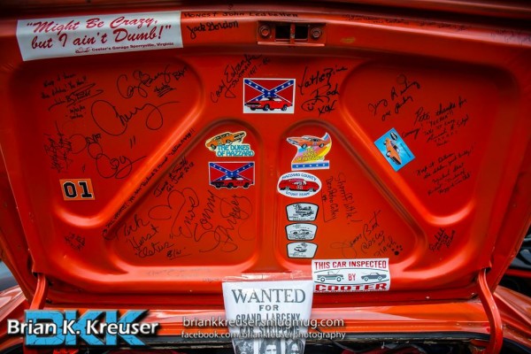 dukes of hazzard autographs on the trunk lid of a general lee dodge charger replica