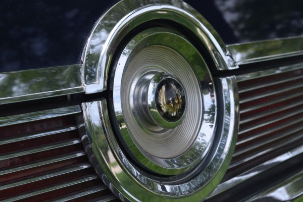 rear trunk emblem badge on a 1967 Chrysler Imperial convertible