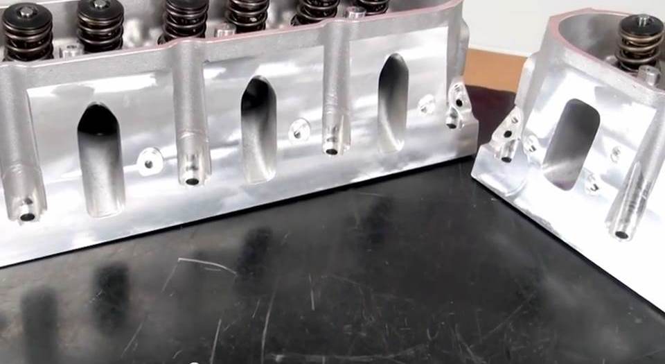 a pair of cylinder heads on a table
