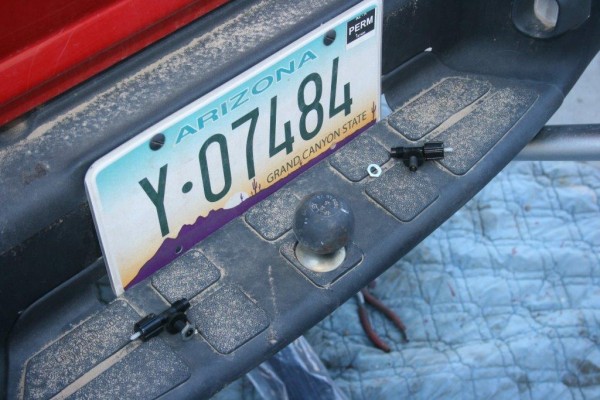 installing a schrader valve for a compressed air system on a jeep bumper