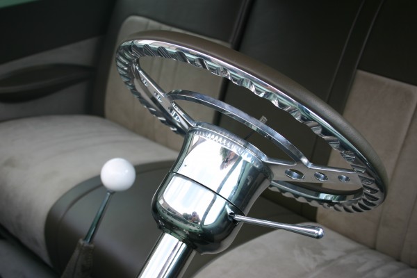 A Billet Specialties steering wheel in a hot rod restomod