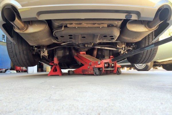 low rear view of a ford mustang on jackstands