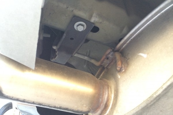 close up of a muffler exhaust hanger
