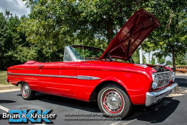 vintage ford falcon convertible at a car show