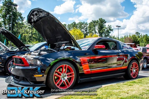 modified ford s197 ford mustang at a cruise in car show