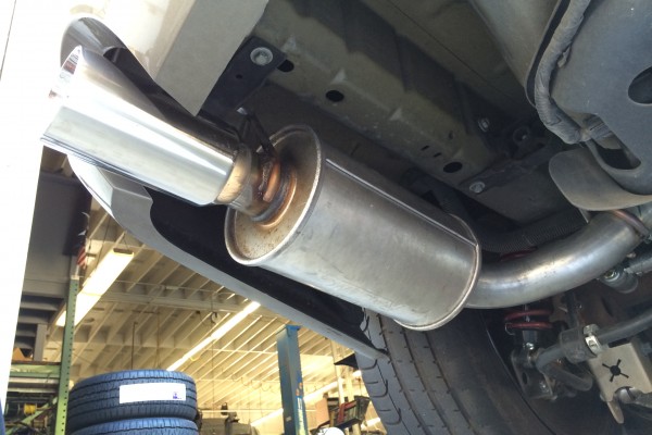 view of a muffler getting installed