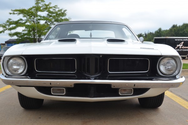 front grille and bumper of a white 1973 plymouth cuda