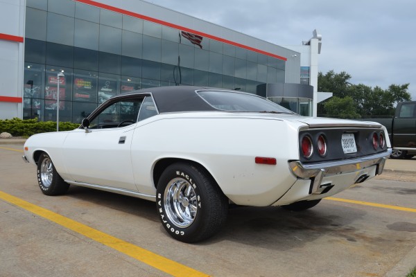 rear quarter view of a white 1973 plymouth cuda