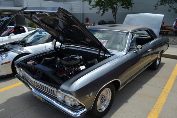 Chevy Chevelle vinyl top car parked at summit racing car show