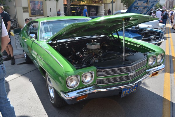 green Chevy Chevelle parked on Reno street during hot august nights