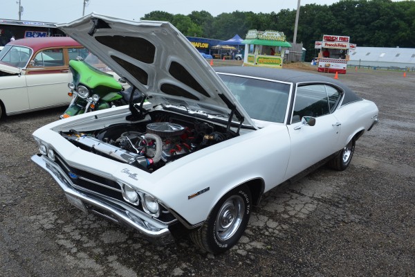 white second gen Chevy Chevelle parked at super summit