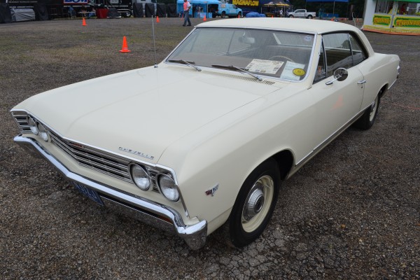 white Chevy Chevelle parked on gravel during super summit