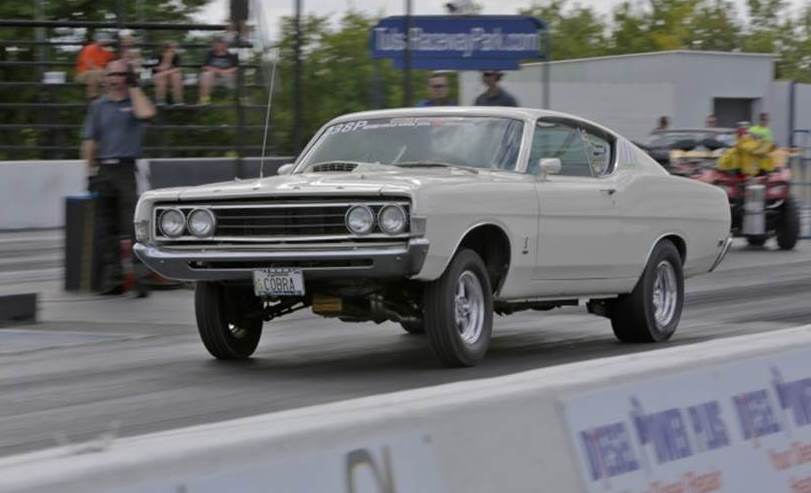 Ford torino drag car launching at a dragstrip