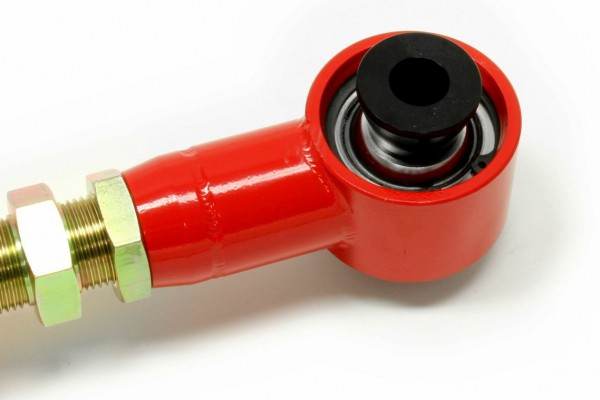 Spherical bushing in a lower control arm
