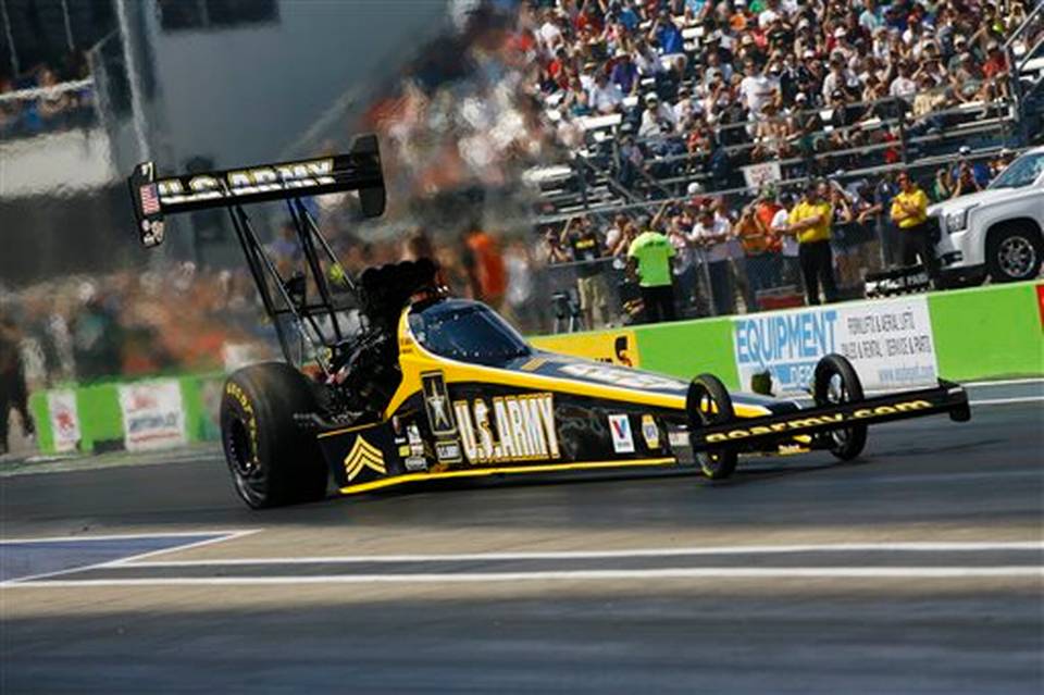 NHRA tony schumacher launching in a top fuel dragster