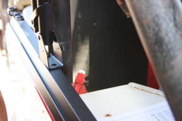 close up of a jeep soft top frame mount bracket