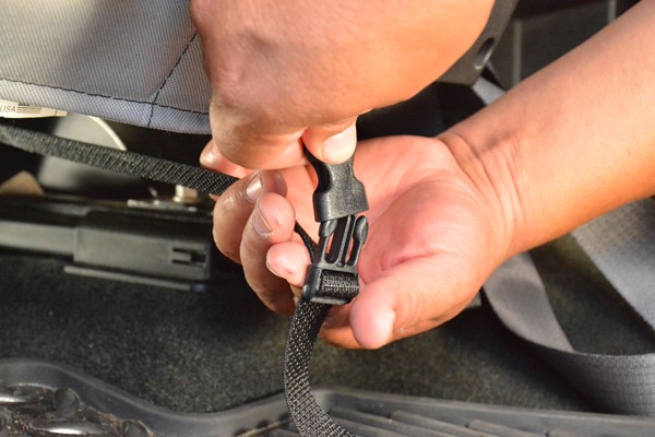 clipping a seat cover into a receptacle