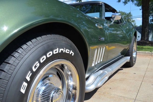 green 1969 chevy corvette stingray, view of side louvers and exhaust pipes