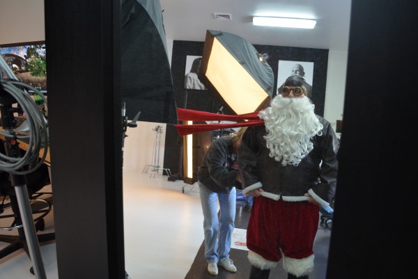 santa dressed up as a pilot for a photo shoot