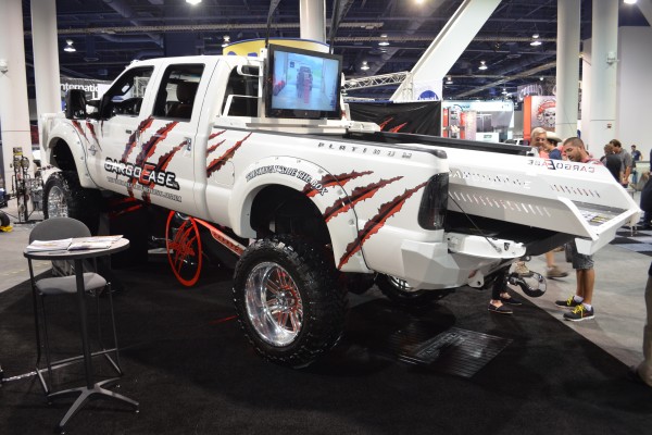 white lifted ford super duty with cargo ease rack at 2014 SEMA automotive trade show