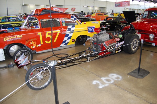 vintage front engine slingshot dragster at car show