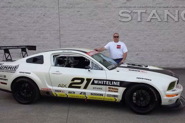 Marc Sorger standing behind his 2008 Mustang GT