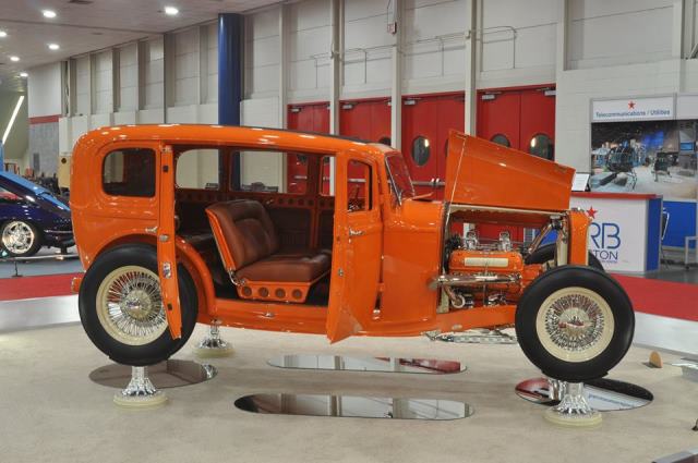 orange hot rod sedan with suicide doors