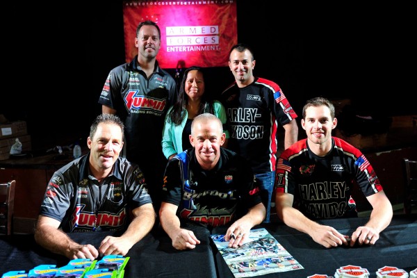 nhra drag race drivers pose wtih military troops