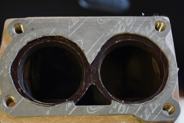 throttle body with gasket applied to mark where porting should occur