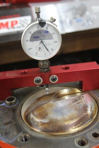 Placing the piston as close to the head as safely possible on a wedge engine generally improves the mixture motion in the chamber and reduces the engine’s sensitivity to detonation.