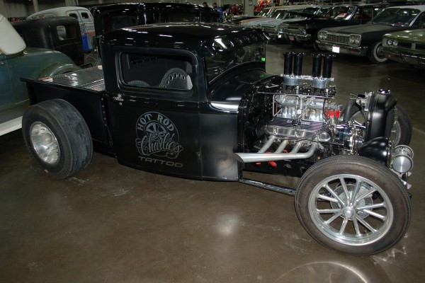 vintage hot rod on display in indoor car show