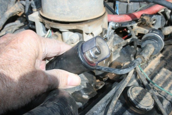 man holding a remote engine starter button