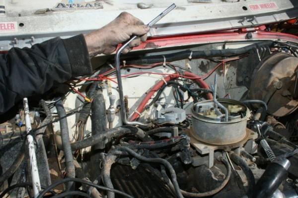 using a special wrench to remove a distributor