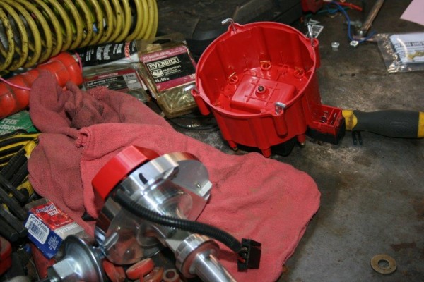 distributor and parts laying on workbench