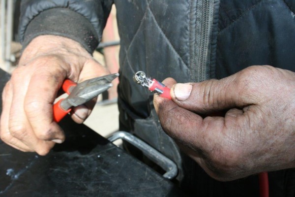 installing a plug terminal on the end of spark wires