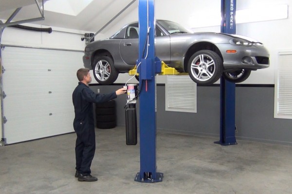 raising a mazda miata on a 2 post lift