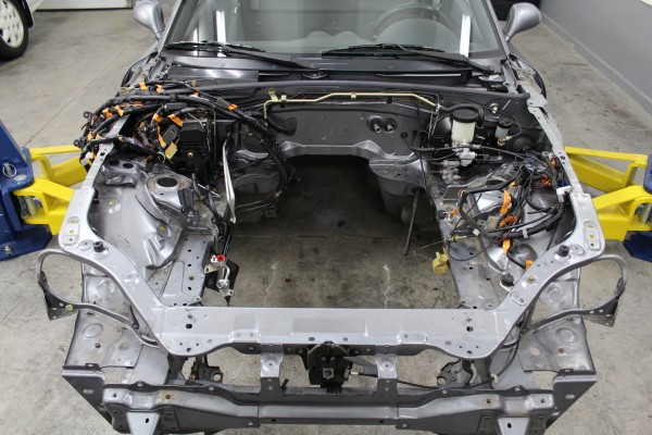 engine bay of a mazda miata with motor removed