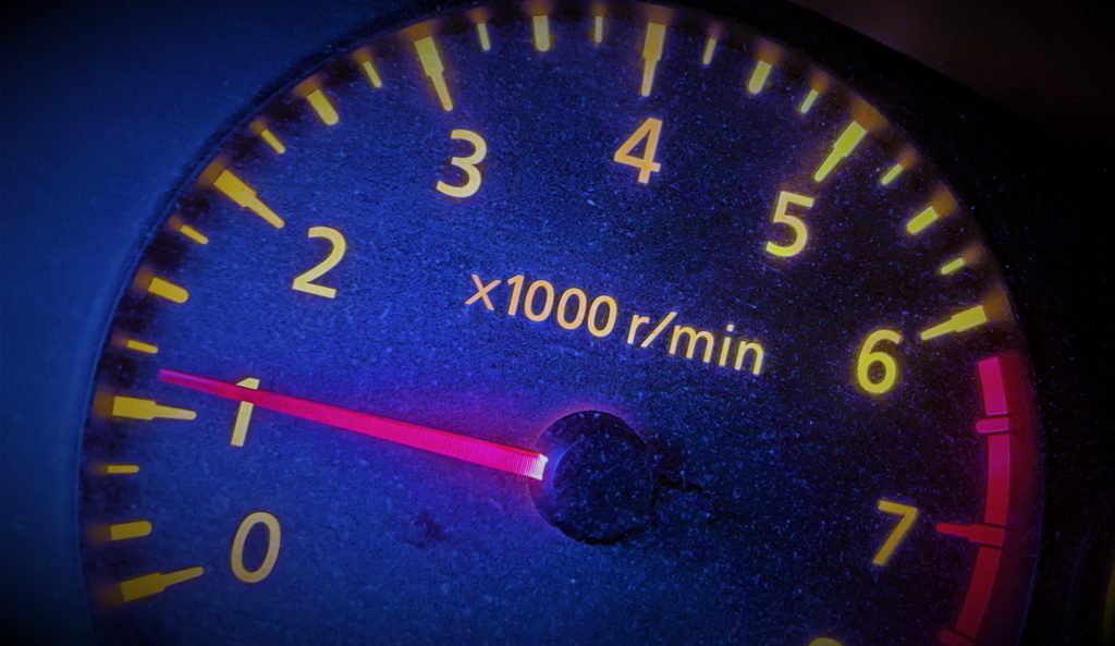 stylized picture of a vehicle tachometer while idling at low RPM