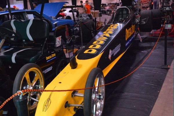 Modern alcohol dragster on display at indoor car show