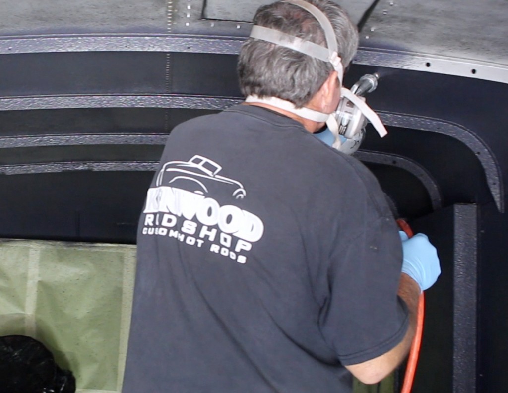 applying lizardskin spray coating to inside of a vintage delivery truck